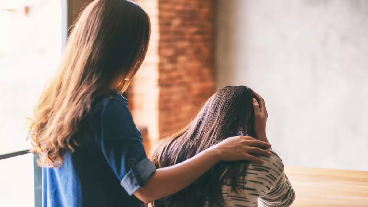 woman providing encouragement to someone in rehab