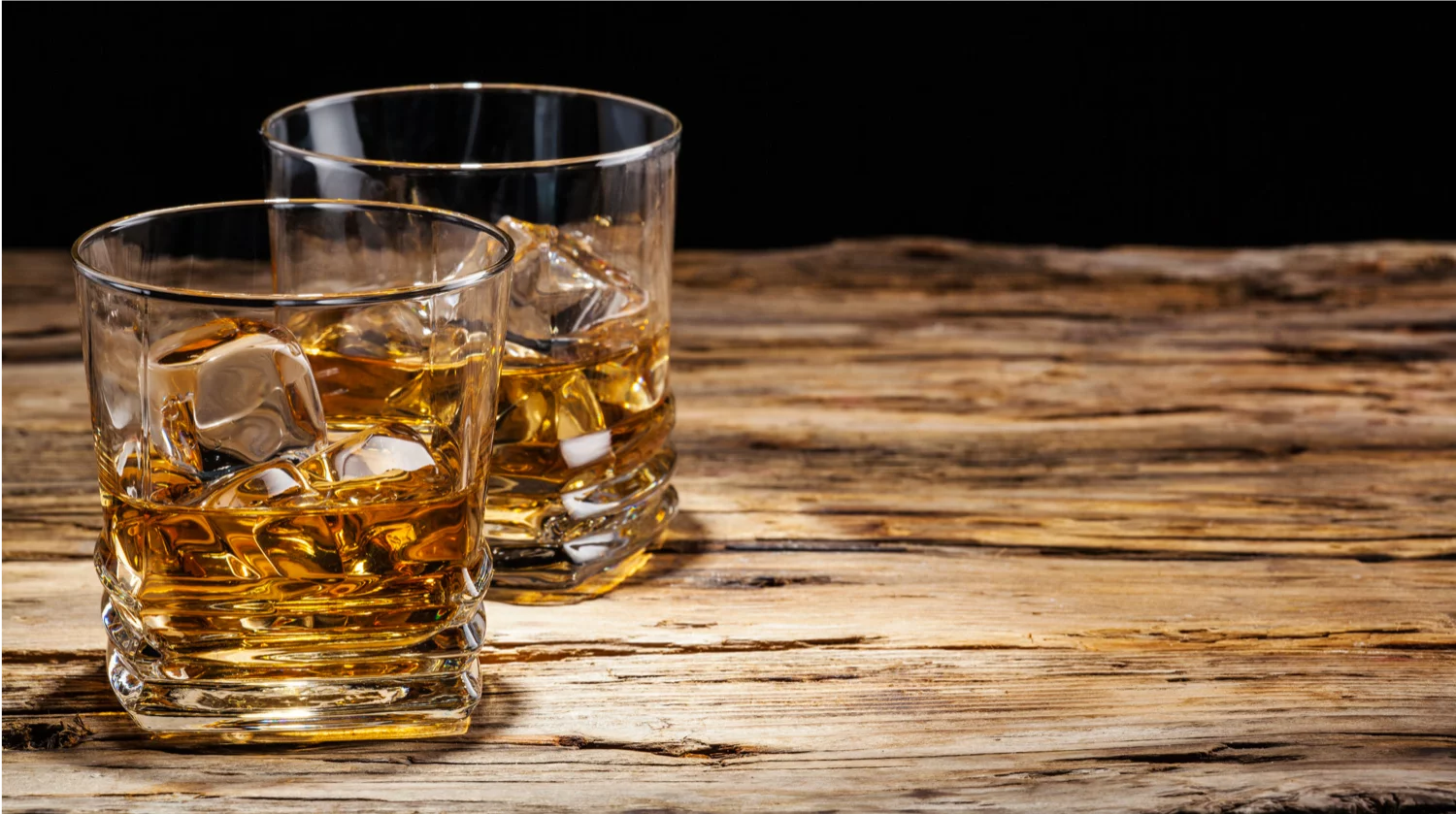 Drinking too much whiskey in glass alcohol abuse